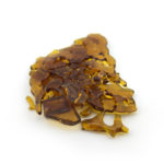 Cannabis shatter concentrate isolated on white backdrop